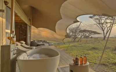 Namiri-Plains-Tent-deck-with-bath-sunbeds-and-cushion-corner